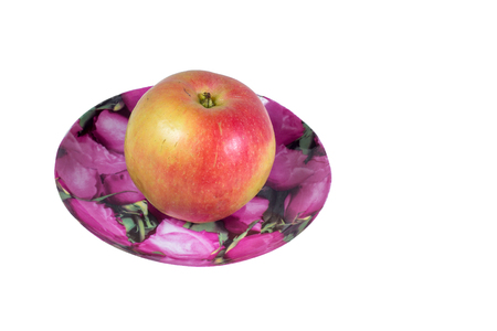 Ripe, juicy apple in a plate on a white background. Vitamin diet for weight loss.の写真素材