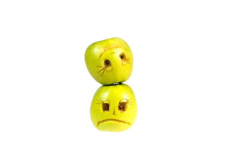 Happy and sad emoticons from apples. Feelings, attitudes and emotions.の写真素材