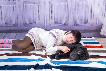 Attractive girl posing in the studio with puppies of breed Mastiff Neapolitana.の写真素材