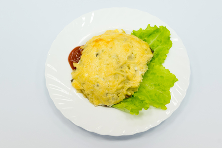 Recipe for European cuisine - pork chop with potatoes and mushrooms baked with cheese.の写真素材