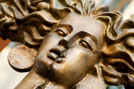 Bronze woman head. Statue part, close-up.の写真素材
