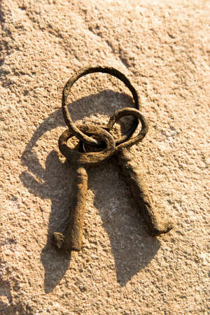 Antique Rusty Keys on a Stoneの写真素材