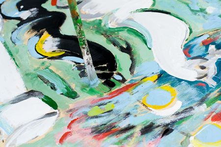 Colorful paint with a paintbrushの写真素材