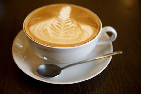 Latte art on a cappucinno (selective DOF)の写真素材