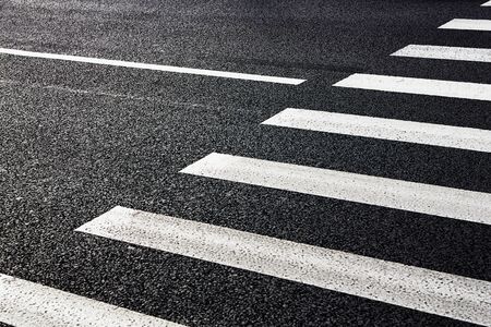 Zebra crosswalk on the road for safety when people walking cross the streetの写真素材