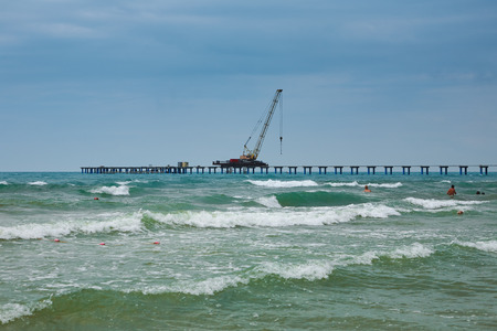 Waves next to the pier under construction