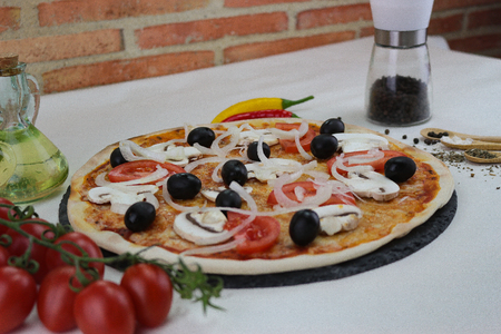 Sliced homemade pepperoni pizzaの写真素材