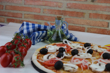 Sliced homemade pepperoni pizzaの写真素材