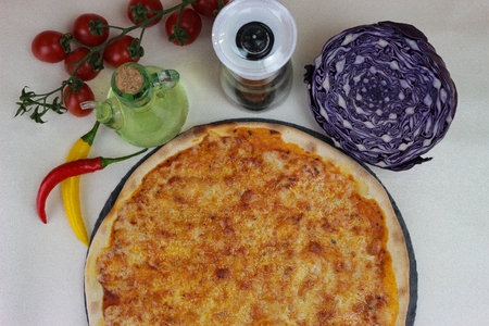 fresh pizza product on tableの写真素材