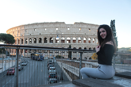 Young woman tourist at Coliseum, Rome.の写真素材