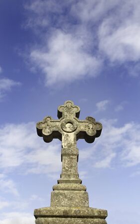 Detail close up of a Christian cross with sky backgroundの写真素材
