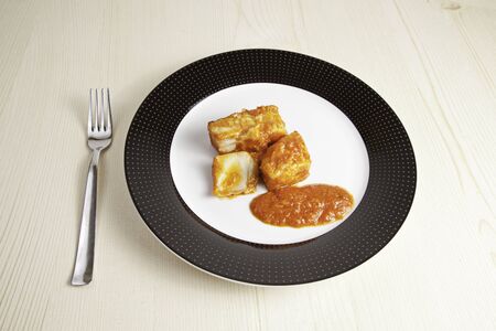 Fish dish with salsa, detail of healthy food in the restaurantの写真素材