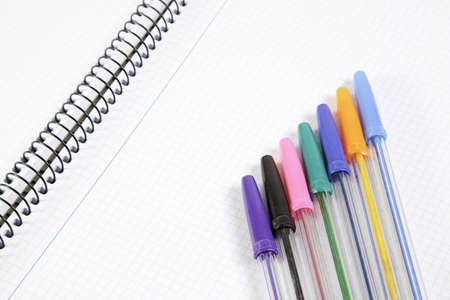 Colored pens on notebook, detail of school, educationの写真素材