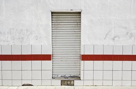 Wall with door closed, abandoned the local detail, exterior detail in the cityの写真素材