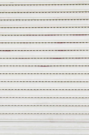 Old shutters in home protection detail in a home in the city, securityの写真素材