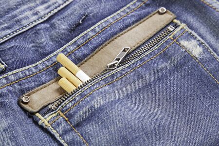 Snuff in jeans, pocket detail with snuff, cigars detail, texture textileの写真素材