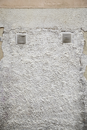 Cement wall grids, detail in the city wall, background with texture urbanの写真素材