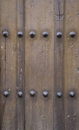 Classic wooden door, wooden door detail spoiled, protective and decorative detail, medievalの写真素材