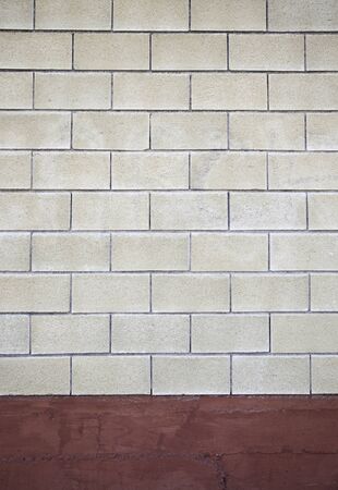 Concrete block wall, detail of textured rough wall, background with texture detail in the city, constructionの写真素材