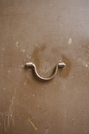 Metal door handle, detail of a metal door in the city, exploration, textured metallic backgroundの写真素材