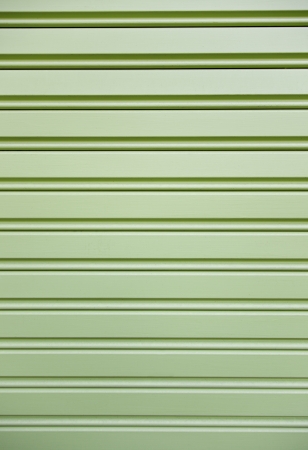 Painted metal grille, metal detail of a wall in the city, background color, urban explorationの写真素材