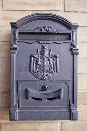 Old metal mailbox post, detail of an old mailbox, tool to send letters abroad, communicationの写真素材