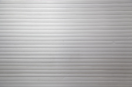 Steel door, detail of a metal door in the city, textured metallic backgroundの写真素材