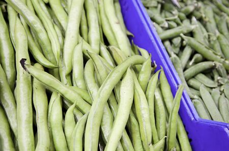 Green beans and peas, detail of vegetables in a market, food healthy, diet