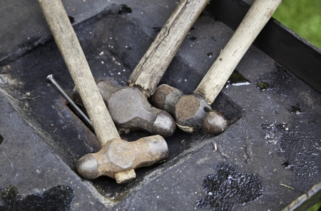 Steel Hammers, detail of a metal forging hammers, anvil, medieval tool