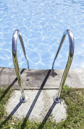 Pool with grass, detail of an outdoor pool in the ciuad, water and funの写真素材