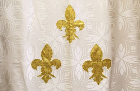 Lily flower fabric, detail of a city textile decoration, goldの写真素材