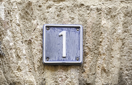 Number one, details of a number one on a wall in the city, signal and informationの写真素材