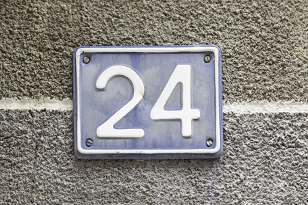 Number twenty, detail of a plaque in the town with the number twenty four, signal and symbol, figureの写真素材