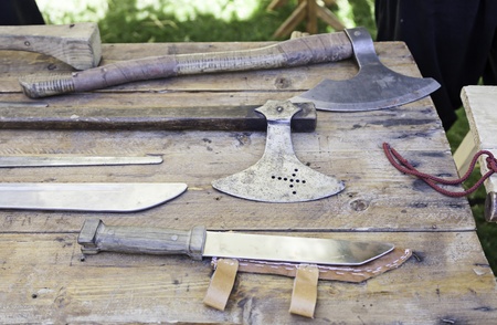 Axes and knives medieval, detail of some ancient weapons of war, pain and death, sharp weaponの写真素材