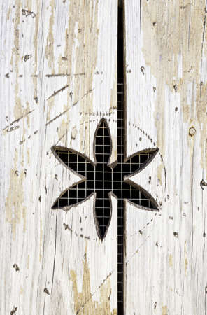 Wooden with flower carved detail of a decorated wooden wallの写真素材