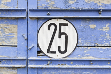 Signal with the number twenty five, detail of a maximum speed signal, information and cautionの写真素材