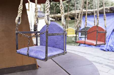 Seats carousel a village fair, detail of a celebration party, kids funの写真素材