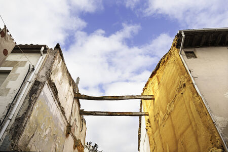 Old houses in ruins, detail of a property in the city, abandonment and desolation, ancient architectureの写真素材
