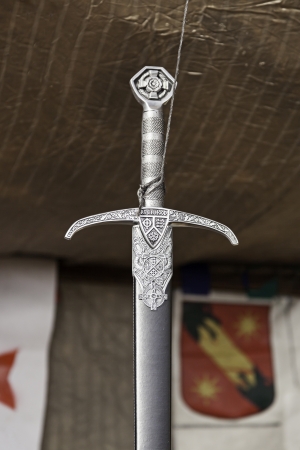 Old medieval sword, detail of an ancient weapon of war, death and detruccion, historical weapon
