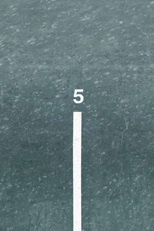 Number five painted wall, detail of a wall with a number of indication, green and whiteの写真素材