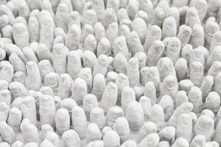 Fingers white rubber detail rubber molds shaped fingers, relief and texture, human handsの写真素材