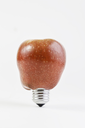 Bulb apple, detail of an electric apple, fruit and sustainable development, environmentの写真素材