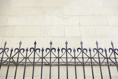 Metal railing on a church, detail of a metal shield on a facade, art and Safetyの写真素材