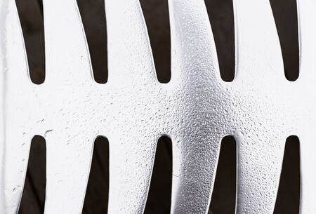 Metal shiny wet with drops, shiny steel detail with water drops of rain, reflection and textureの写真素材