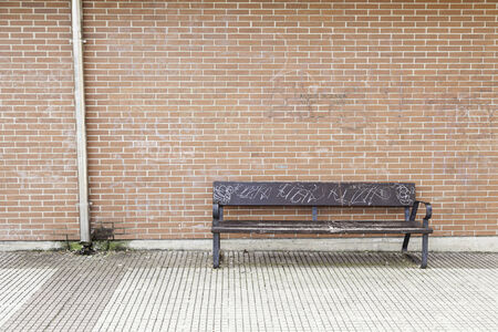 Wooden seat in the city, details of street furniture in the city bench to restの写真素材