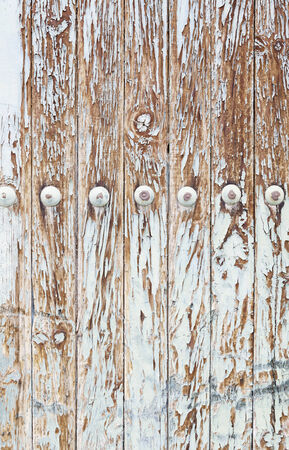 Wooden wall damaged, detail of an old wooden wall coated, decoration and neglectの写真素材