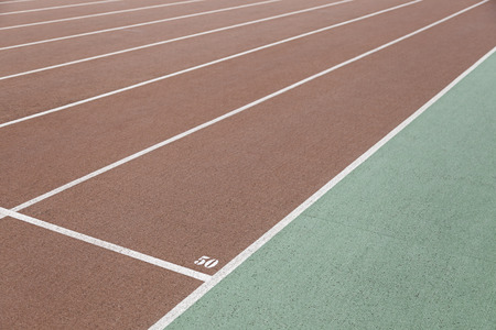 Detail of an athletics track, detail of a running track, outdoor sports, aerobic sports, signal fifty yardsの写真素材