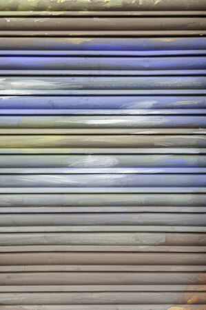 Metal fence colors, detail of a closed gate protection and decorated with colorsの写真素材