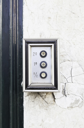 Old intercom on a street in Lisbon, detail of a home electric appliance