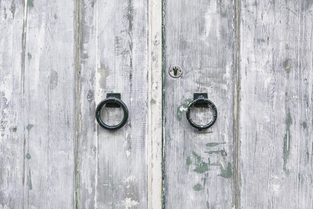 Old wooden door, detail of an old door damaged, securityの写真素材